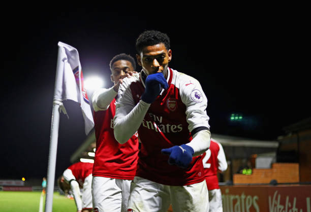BOREHAMWOOD, ENGLAND - JANUARY 23:  Jeff Reine-Adelaide of Arsenal celebrates after scoring his sides fourth goal during the Premier League International Cup match between Arsenal and Bayern Munich at Meadow Park on January 23, 2018 in Borehamwood, England.  (Photo by Naomi Baker/Getty Images)