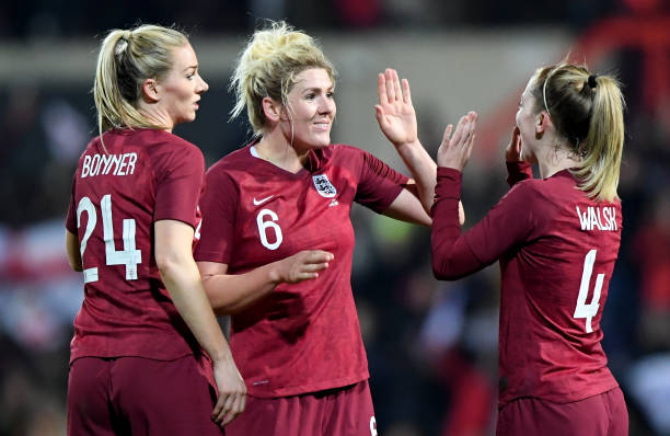 SWINDON, ENGLAND - APRIL 09: Gemma Bonner, Millie Bright and Kiera Walsh of England celebrate victory during the International Friendly between England Women and Spain Women at the County Ground on April 09, 2019 in Swindon, England. (Photo by Alex Davidson/Getty Images)