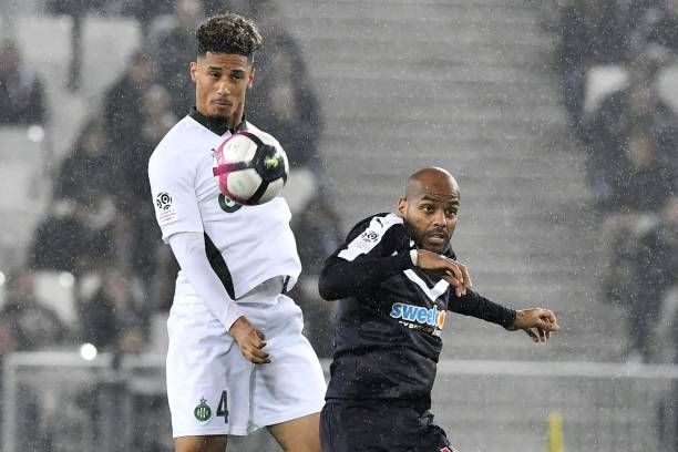Saint-Etienne's French defender William Saliba (L) vies with Bordeaux's French forward Jimmy Briand during the French L1 football match between FC Girondins de Bordeaux and AS Saint-Etienne at the Matmut Atlantique stadium in Bordeaux, southwestern France on December 5, 2018. (Photo by NICOLAS TUCAT / AFP)
