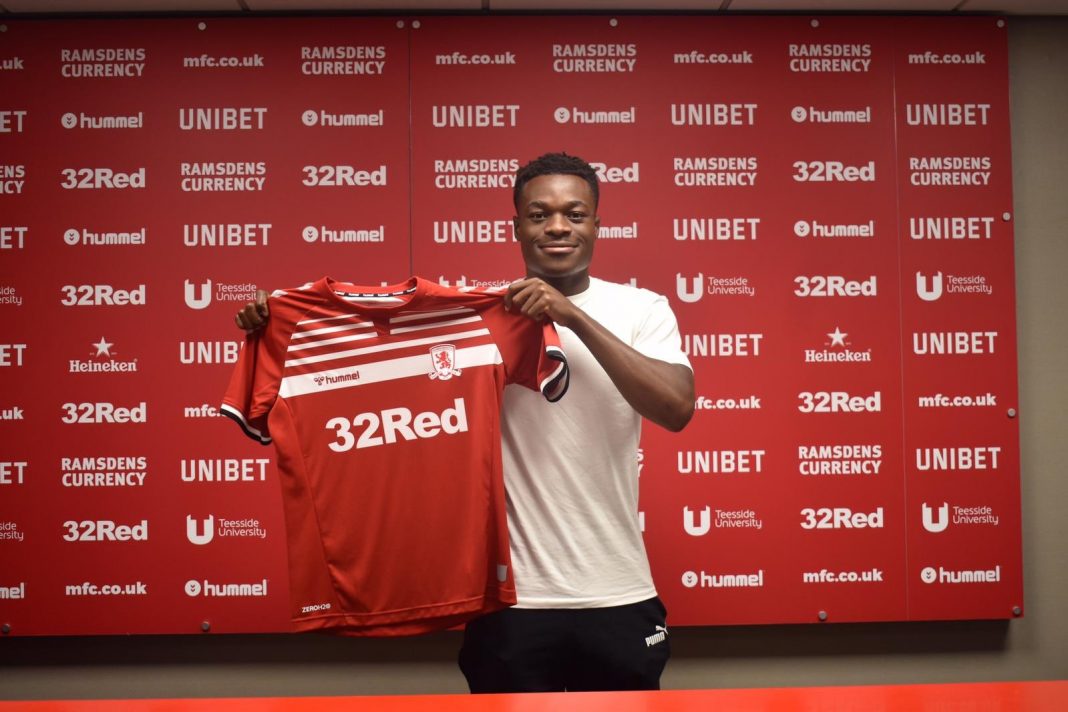 Marc Bola posing with his Middlesbrough shirt (Photo via Twitter / MarcBola27)