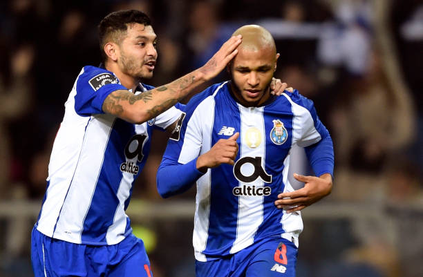 Porto's Algerian forward Yacine Brahimi (R) is congratulated by teammate Mexican forward Jesus Corona after scoring a goal during the Portuguese League football match between FC Porto and CD Nacional Funchal at the Dragao stadium in Porto on January 7, 2019. (Photo by MIGUEL RIOPA / AFP)