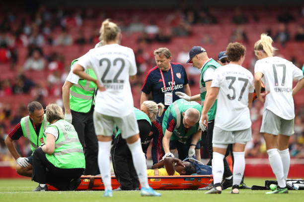 LONDON, ENGLAND - JULY 28: Danielle Carter of Arsenal is stretchered off of the pitch during the Emirates Cup match between Arsenal Women and FC Bayern Munich Women at Emirates Stadium on July 28, 2019 in London, England. (Photo by Alex Pantling/Getty Images)