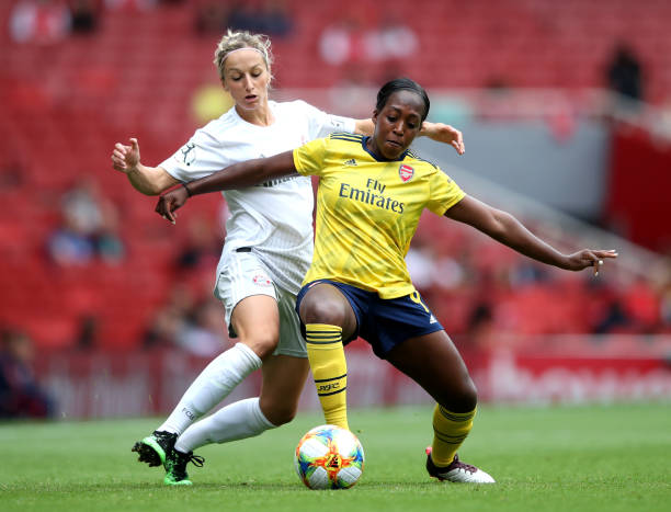 LONDON, ENGLAND - JULY 28: Danielle Carter of Arsenal is tackled by Kathrine Hendrich of Bayern Munich of Bayern Munich during the Emirates Cup match between Arsenal Women and FC Bayern Munich Women at Emirates Stadium on July 28, 2019 in London, England. (Photo by Alex Pantling/Getty Images)
