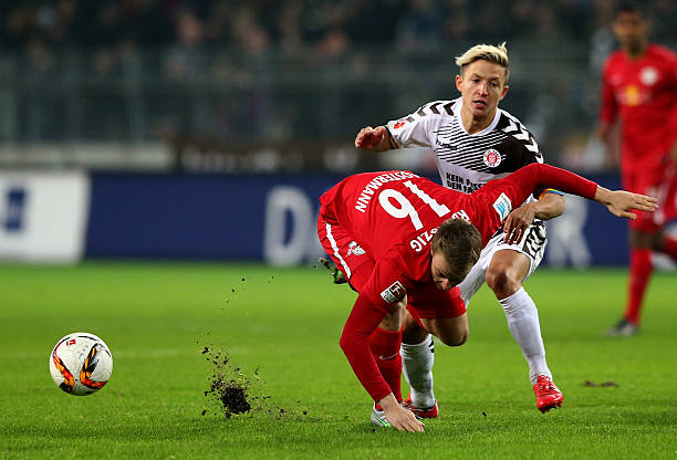 HAMBURG, GERMANY - FEBRUARY 12:  Marc Rzatkowski (R) of St. Pauli challenges for the ball with Lukas Klosterman of Leipzig during the second Bundesliga match between FC St. Pauli and RB Leipzig at Millerntor Stadium on February 12, 2016 in Hamburg, Germany.  (Photo by Martin Rose/Bongarts/Getty Images)