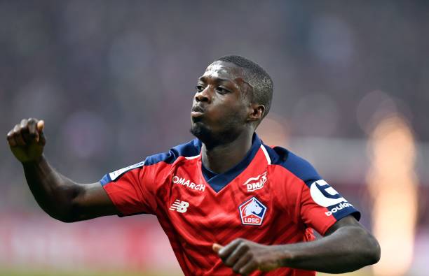 Lille's Ivorian forward Nicolas Pepe celebrates after scoring a goal during the French L1 football match between Lille (LOSC) and Angers (SCO) at the Pierre-Mauroy Stadium in Villeneuve d'Ascq, near Lille, northern France, on May 18 2019. (Photo by DENIS CHARLET / AFP)