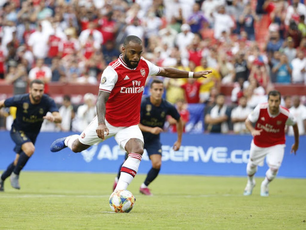 Alexandre Lacazette taking a penalty against Real Madrid in pre-season (Photo via Reuters)
