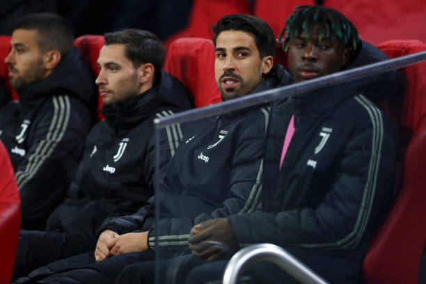 AMSTERDAM, NETHERLANDS - APRIL 10: Sami Khedira and Moise Kean sit on the bench during the UEFA Champions League Quarter Final first leg match between Ajax and Juventus at Johan Cruyff Arena on April 10, 2019 in Amsterdam, Netherlands. (Photo by Lars Baron/Getty Images)