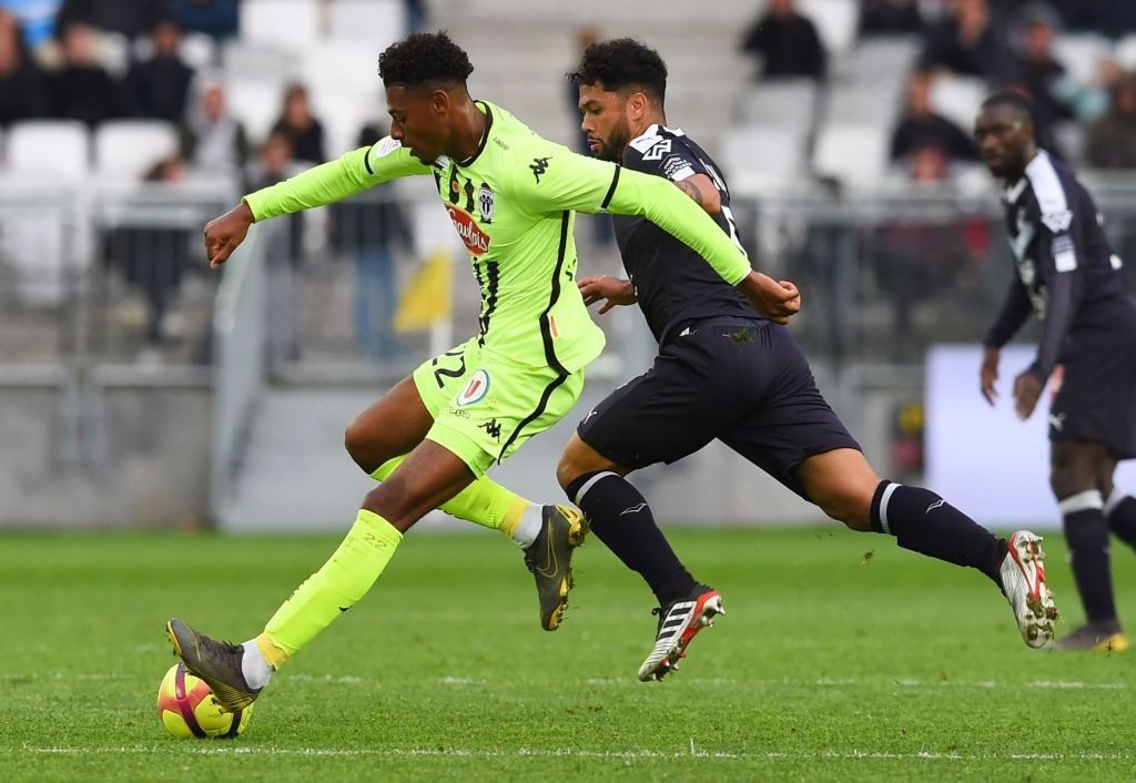 Angers' French midfielder Jeff Reine-Adelaide (L) vies with Bordeaux' Brazilian midfielder Otavio during the French L1 football match between Bordeaux and Angers on May 4, 2019, in Bordeaux. (Photo by NICOLAS TUCAT / AFP / Getty Images)