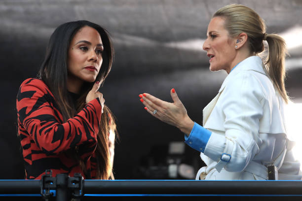 LE HAVRE, FRANCE - JUNE 14: Former England player Alex Scott speaks with presenter Gabby Logan prior to the 2019 FIFA Women's World Cup France group D match between England and Argentina at on June 14, 2019 in Le Havre, France. (Photo by Marc Atkins/Getty Images)