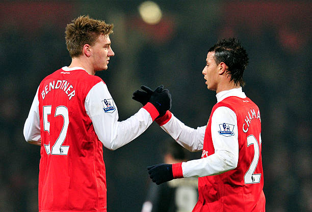 Arsenal's Danish striker Nicklas Bendtner (L) celebrates scoring the second goal with Moroccan striker Marouane Chamakh (R) during their FA Cup fifth round replay football match against Leyton Orient at the Emirates Stadium, London, England, on March 2, 2011. AFP PHOTO/ GLYN KIRK