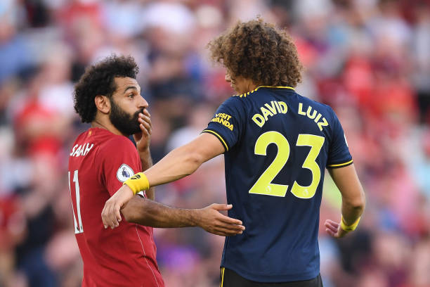 LIVERPOOL, ENGLAND - AUGUST 24: Mohamed Salah of Liverpool and David Luiz of Arsenal talk after the Premier League match between Liverpool FC and Arsenal FC at Anfield on August 24, 2019 in Liverpool, United Kingdom. (Photo by Laurence Griffiths/Getty Images)