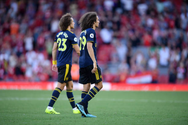 LIVERPOOL, ENGLAND - AUGUST 24: Matteo Guendouzi and David Luiz of Arsenal walk off the pitch following their sides defeat in the Premier League match between Liverpool FC and Arsenal FC at Anfield on August 24, 2019 in Liverpool, United Kingdom. (Photo by Laurence Griffiths/Getty Images)