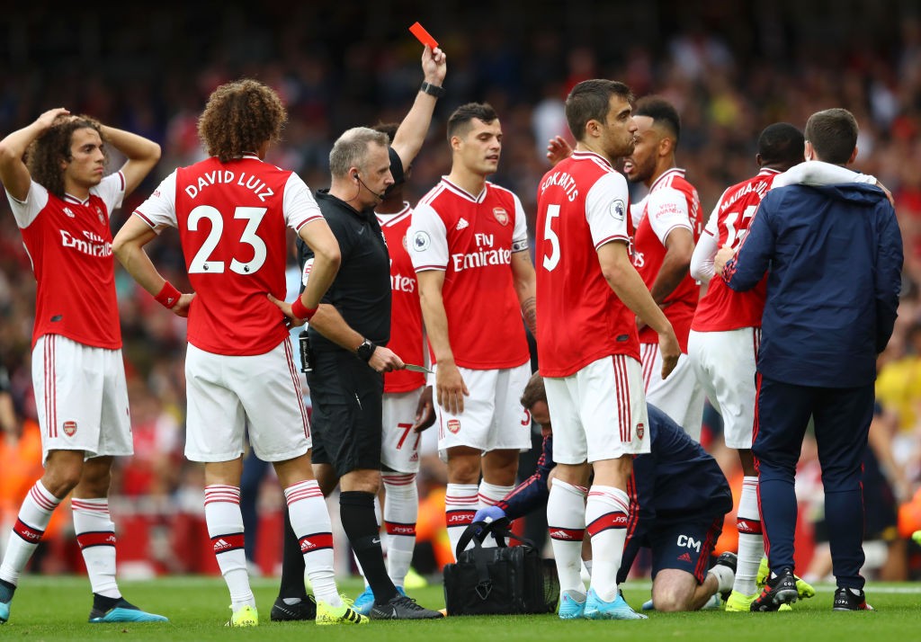 LONDON, ENGLAND - SEPTEMBER 22: Ainsley Maitland-Niles of Arsenal fouls Neil Taylor of Aston Villa leading to a red card and his dismissal during the Premier League match between Arsenal FC and Aston Villa at Emirates Stadium on September 22, 2019, in London, United Kingdom. (Photo by Michael Steele/Getty Images)