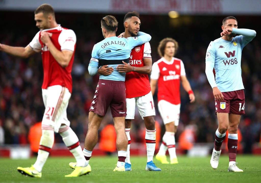 LONDON, ENGLAND - SEPTEMBER 22: Pierre-Emerick Aubameyang of Arsenal hugs Jack Grealish of Aston Villa after the Premier League match between Arsenal FC and Aston Villa at Emirates Stadium on September 22, 2019, in London, United Kingdom. (Photo by Steve Bardens/Getty Images)