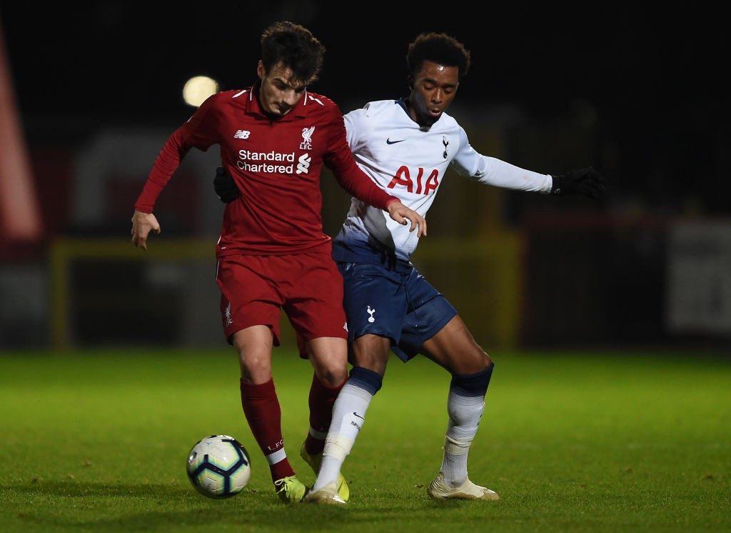 STEVENAGE, ENGLAND - JANUARY 07: Pedro Chirivella of Liverpool is challenged by Tashan Oakley-Booth of Tottenham Hotspur in the Premier League 2 match between Tottenham Hotspur and Liverpool at The Lamex Stadium on January 07, 2019, in Stevenage, England. (Photo by Harriet Lander/Getty Images)
