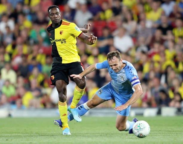 WATFORD, ENGLAND - AUGUST 27: Liam Kelly of Coventry City is challenged by Danny Welbeck of Watford during the Carabao Cup Second Round match between Watford and Coventry City at Vicarage Road on August 27, 2019 in Watford, England. (Photo by Linnea Rheborg/Getty Images)