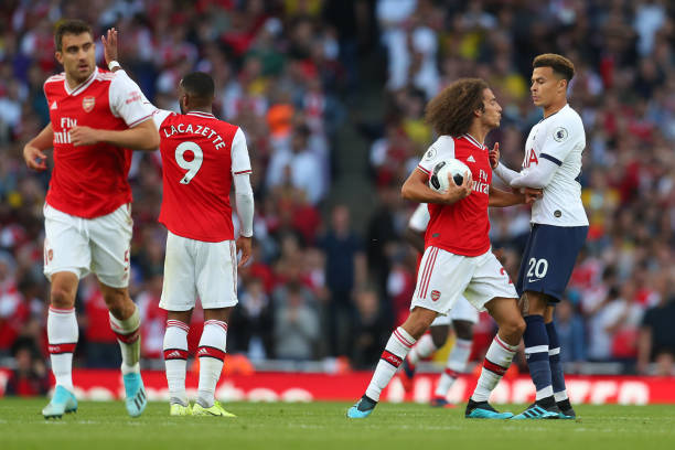 LONDON, ENGLAND - SEPTEMBER 01: Matteo Guendouzi of Arsenal clashes with Dele Alli of Tottenham Hotspur (R) during the Premier League match between Arsenal FC and Tottenham Hotspur at Emirates Stadium on September 01, 2019 in London, United Kingdom. (Photo by Catherine Ivill/Getty Images)
