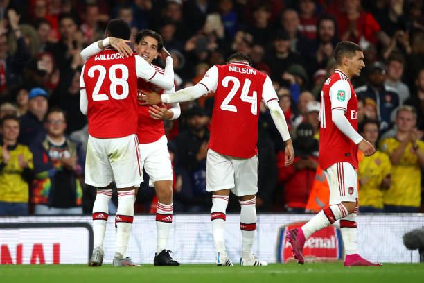 LONDON, ENGLAND - SEPTEMBER 24:  Joe Willock of Arsenal celebrates scoring his teams third goal of the game with team mate Hector Bellerin during the Carabao Cup Third Round match between Arsenal FC and Nottingham Forrest at Emirates Stadium on September 24, 2019 in London, England. (Photo by Julian Finney/Getty Images)