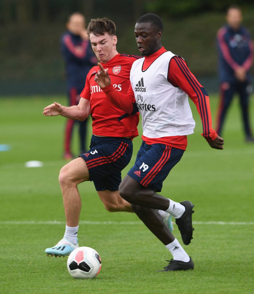 ST ALBANS, ENGLAND - SEPTEMBER 12: Nicolas Pepe takes on Kieran Tierney of Arsenal during the Arsenal Training Session at London Colney on September 12, 2019 in St Albans, England. (Photo by David Price/Arsenal FC via Getty Images)