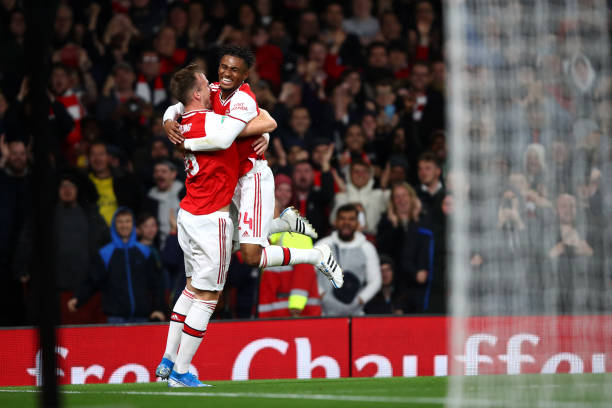 LONDON, ENGLAND - SEPTEMBER 24:  Rob Holding of Arsenal celebrates scoring his teams second goal of the game with team mate Reiss Nelson during the Carabao Cup Third Round match between Arsenal FC and Nottingham Forrest at Emirates Stadium on September 24, 2019 in London, England. (Photo by Julian Finney/Getty Images)