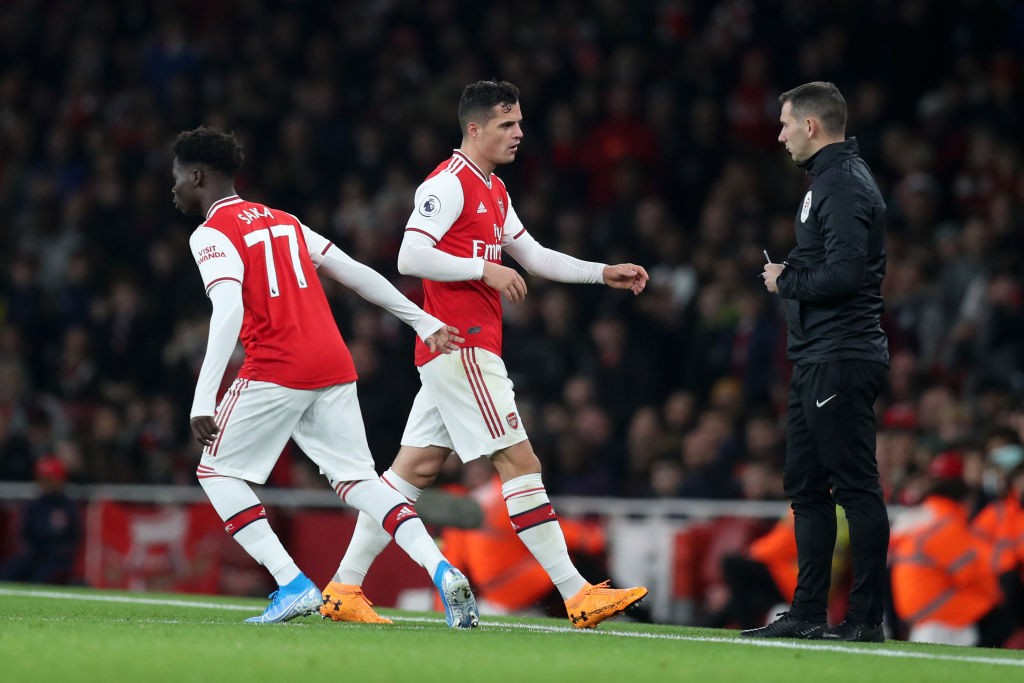 LONDON, ENGLAND - OCTOBER 27: Granit Xhaka of Arsenal is substituted off for Bukayo Saka of Arsenal during the Premier League match between Arsenal FC and Crystal Palace at Emirates Stadium on October 27, 2019, in London, United Kingdom. (Photo by Alex Morton/Getty Images)