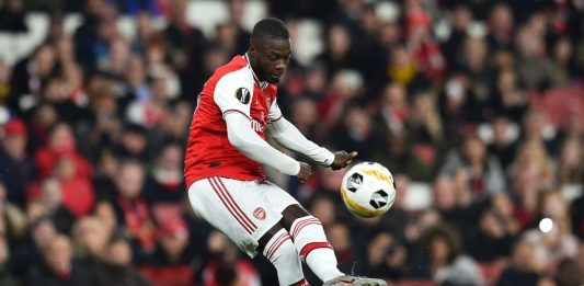 Arsenal's French-born Ivorian midfielder Nicolas Pepe takes a free-kick to scores his team's second goal during their UEFA Europa league Group F football match between Arsenal and Vitoria Guimaraes at the Emirates stadium in London on October 24, 2019. (Photo by Glyn KIRK / AFP / Getty Images)