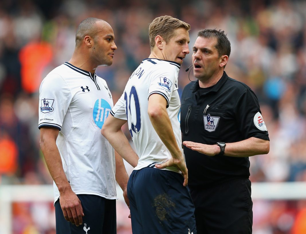 LIVERPOOL, ENGLAND - MARCH 30: Referee Phil Dowd speaks to Younes Kaboul and Michael Dawson of Tottenham Hotspur during the Barclays Premier League match between Liverpool and Tottenham Hotspur at Anfield on March 30, 2014, in Liverpool, England. (Photo by Alex Livesey/Getty Images)