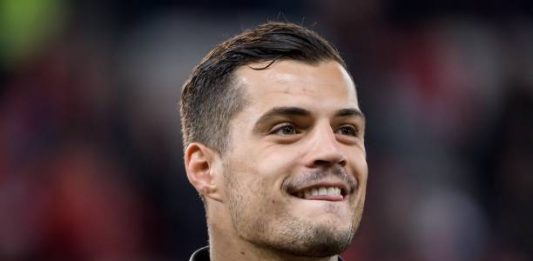 Switzerland's midfielder Granit Xhaka smiles prior to the Euro 2020 football qualification match between Switzerland and Ireland at the Stade de Geneve stadium on October 15, 2019 in Geneva. (Photo by Fabrice COFFRINI / AFP)