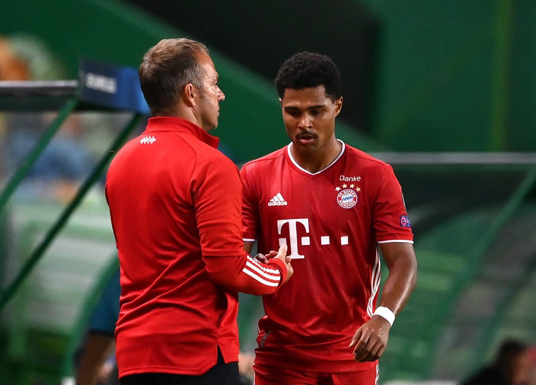 LISBON, PORTUGAL - AUGUST 19: Serge Gnabry of Bayern Munich interacts with Hans-Dieter Flick, Head Coach of Bayern Munich after being substituted off during the UEFA Champions League Semi Final match between Olympique Lyonnais and Bayern Munich at Estadio Jose Alvalade on August 19, 2020 in Lisbon, Portugal. (Photo by Franck Fife/Pool via Getty Images)