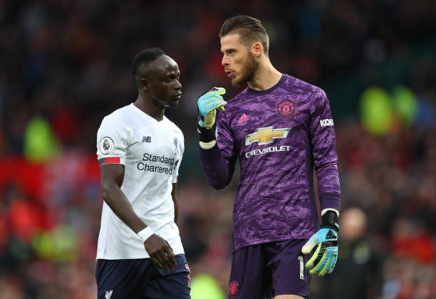 MANCHESTER, ENGLAND - OCTOBER 20: Sadio Mané of Liverpool and David De Gea of Manchester United chat during the Premier League match between Manchester United and Liverpool FC at Old Trafford on October 20, 2019 in Manchester, United Kingdom. (Photo by Catherine Ivill/Getty Images)