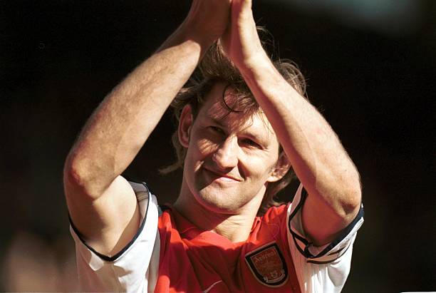 5 May 2001: Captain Tony Adams of Arsenal applauds the crowd as Arsenal qualify for next years Champions League after the match between Arsenal v Leeds United in the FA Carling Premiership at Highbury, London. Credit: Mike Hewitt/ALLSPORT