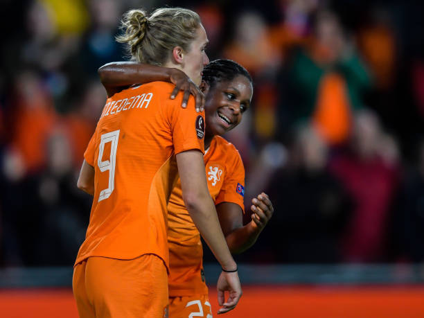 Netherlands' forward Vivianne Miedema (L) celebrates with Netherlands' defender Liza van der Most during the Women's UEFA Euro 2021 group stage qualification football match between Netherlands and Russia on October 8, 2019. (Photo by Gerrit VAN KEULEN / ANP / AFP) / Netherlands OUT (Photo by GERRIT VAN KEULEN/ANP/AFP via Getty Images)