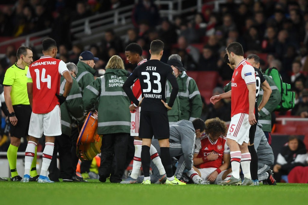 LONDON, ENGLAND - NOVEMBER 28: David Luiz of Arsenal receives medical treatment during the UEFA Europa League group F match between Arsenal FC and Eintracht Frankfurt at Emirates Stadium on November 28, 2019, in London, United Kingdom. (Photo by Mike Hewitt/Getty Images)