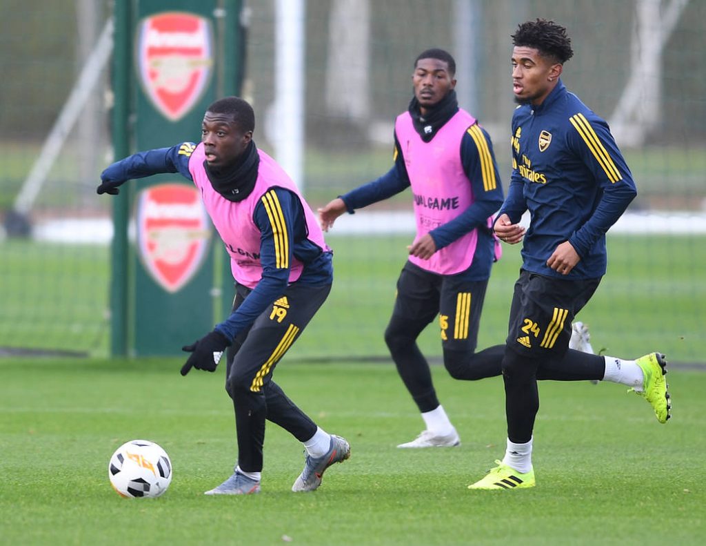 ST ALBANS, ENGLAND - NOVEMBER 05: Nicolas Pépé, Ainsley Maitland-Niles and Reiss Nelson of Arsenal during a training session at London Colney on November 05, 2019, in St Albans, England. (Photo by Stuart MacFarlane/Arsenal FC via Getty Images)