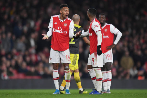 LONDON, ENGLAND - NOVEMBER 23: Pierre-Emerick Aubameyang of Arsenal talks to Alexandre Lacazette of Arsenal during the Premier League match between Arsenal FC and Southampton FC at Emirates Stadium on November 23, 2019 in London, United Kingdom. (Photo by Shaun Botterill/Getty Images)
