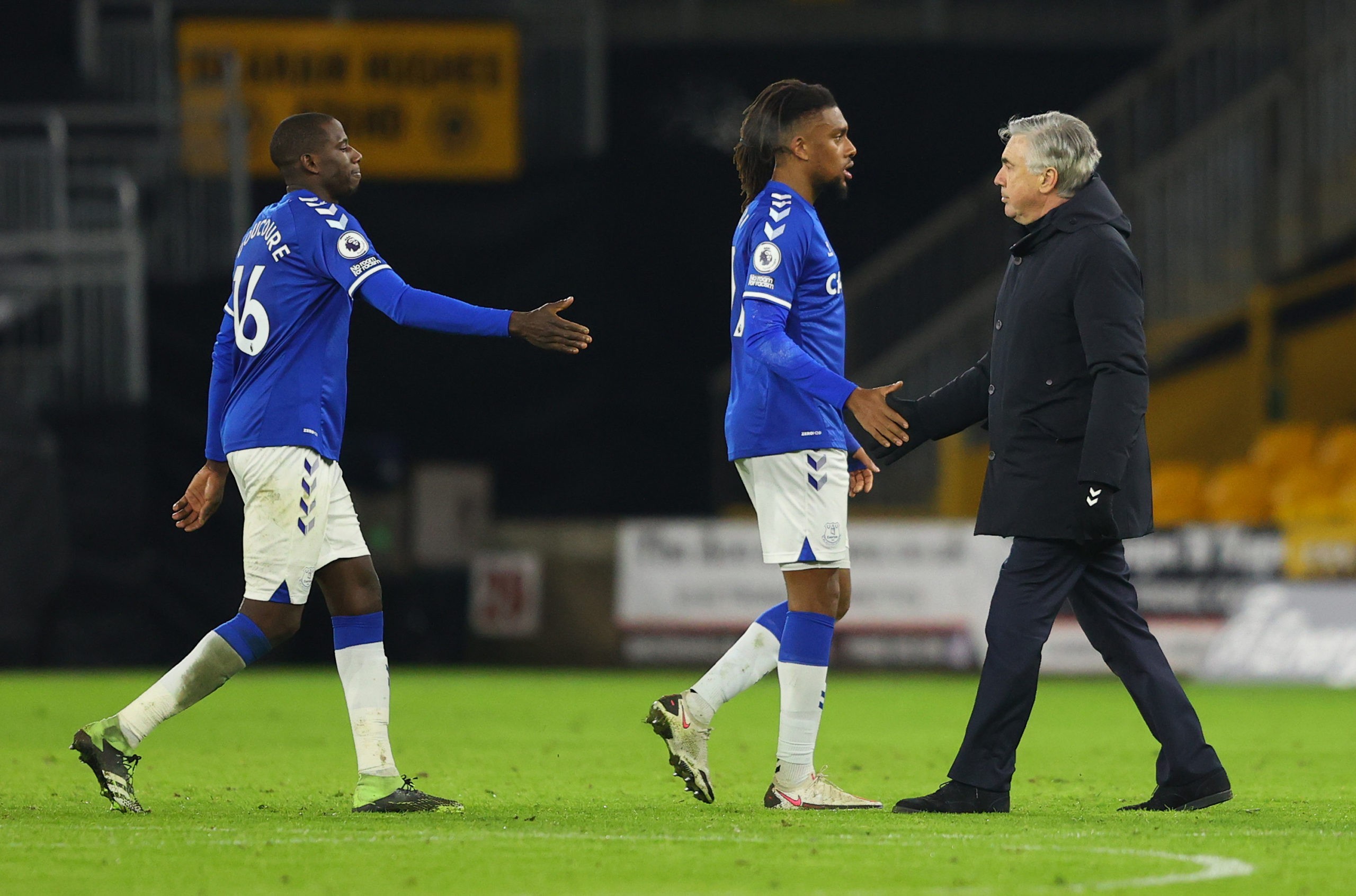 Alex Iwobi WOLVERHAMPTON, ENGLAND - JANUARY 12: Carlo Ancelotti, manager of Everton (R) shakes hands with Alex Iwobi of Everton after the Premier League match between Wolverhampton Wanderers and Everton at Molineux on January 12, 2021 in Wolverhampton, England. Sporting stadiums around England remain under strict restrictions due to the Coronavirus Pandemic as Government social distancing laws prohibit fans inside venues resulting in games being played behind closed doors. (Photo by Richard Heathcote/Getty Images)