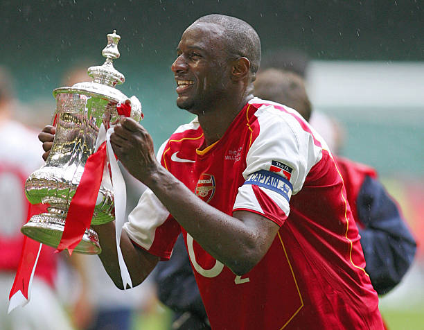 Cardiff, UNITED KINGDOM: (FILES) Picture taken 21 May 2005 at the Millennium Dome in Cardiff, shows Arsenal's Patrick Vieira lifting the FA Cup after Arsenal defeated Manchester United in the FA Cup Final football match. Juventus were reported to be poised to sign Arsenal captain Patrick Vieira, 14 July 2005. (Photo credit ADRIAN DENNIS/AFP via Getty Images)
