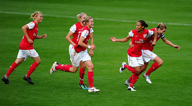 BURTON-UPON-TRENT, ENGLAND - SEPTEMBER 25: Jayne Ludlow and Rachel Yankee of Arsenal Ladies FC lead the race to celebrate with Laura Harvey after the fourth goal during the FA WSL Continental Cup Final between Birmingham City Ladies FC v Arsenal Ladies FC on September 25, 2011 in Burton-upon-Trent, England. (Photo by Laurence Griffiths/Getty Images)