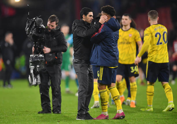 BOURNEMOUTH, ENGLAND - DECEMBER 26: Mikel Arteta, Manager of Arsenal speaks to Reiss Nelson of Arsenal following their draw in the Premier League match between AFC Bournemouth and Arsenal FC at Vitality Stadium on December 26, 2019 in Bournemouth, United Kingdom. (Photo by Justin Setterfield/Getty Images)