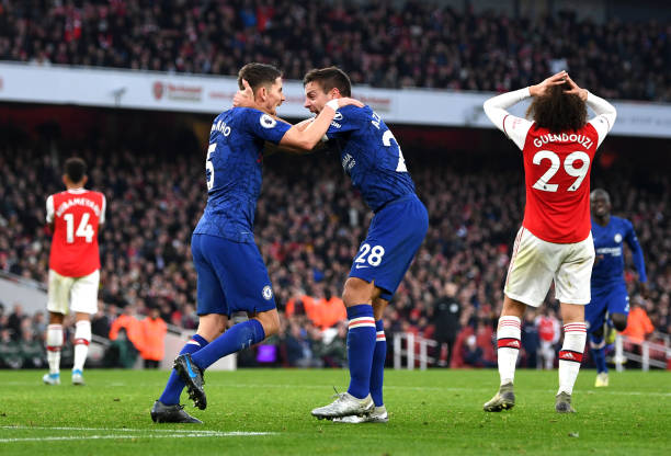 LONDON, ENGLAND - DECEMBER 29: Jorginho of Chelsea celebrates with Cesar Azpilicueta of Chelsea after scoring his sides first goal during the Premier League match between Arsenal FC and Chelsea FC at Emirates Stadium on December 29, 2019 in London, United Kingdom. (Photo by Shaun Botterill/Getty Images)