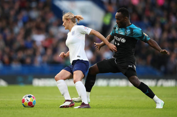 LONDON, ENGLAND - JUNE 16:  Katie Chapman of England evades Michael Essien of Soccer Aid World XI during the Soccer Aid for UNICEF 2019 match between England and the Soccer Aid World XI at Stamford Bridge on June 16, 2019 in London, England. (Photo by Alex Pantling/Getty Images)