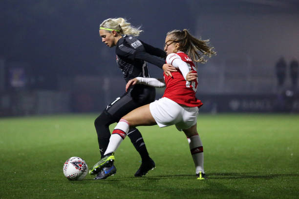 BOREHAMWOOD, ENGLAND - OCTOBER 31: Katerina Svitkova of SK Slavia Praha and Lia Walti of Arsenal battle for the ball during the UEFA Women's Champions League Round of 16 Second Leg match between Arsenal Women and SK Slavia Praha at Meadow Park on October 31, 2019 in Borehamwood, England. (Photo by Kate McShane/Getty Images)