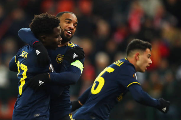 LIEGE, BELGIUM - DECEMBER 12: Bukayo Saka of Arsenal celebrates after scoring his team's second goal with teammate Alexandre Lacazette during the UEFA Europa League group F match between Standard Liege and Arsenal FC at Stade Maurice Dufrasne on December 12, 2019 in Liege, Belgium. (Photo by Dean Mouhtaropoulos/Getty Images)