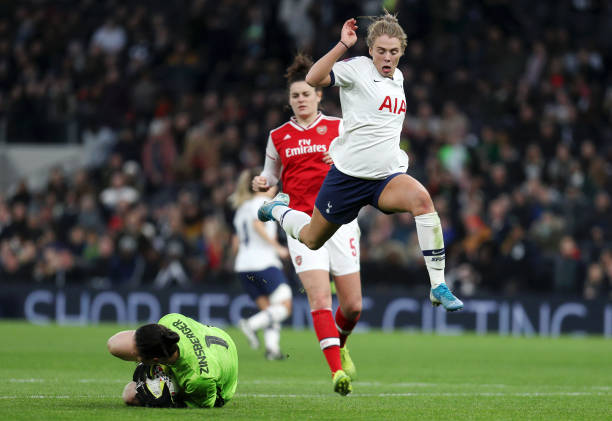 LONDON, ENGLAND - NOVEMBER 17: Rianna Dean of Tottenham Hotspur jumps over Manuela Zinsberger of Arsenal as she makes a save during the Barclays FA Women's Super League match between Tottenham Hotspur and Arsenal at Tottenham Hotspur Stadium on November 17, 2019 in London, United Kingdom. (Photo by Kate McShane/Getty Images)