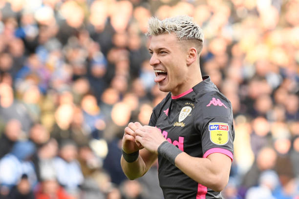 HUDDERSFIELD, ENGLAND - DECEMBER 07: Ezgjan Alioski of Leeds United celebrates after scoring his sides first goal during the Sky Bet Championship match between Huddersfield Town and Leeds United at John Smith's Stadium on December 07, 2019 in Huddersfield, England. (Photo by George Wood/Getty Images)