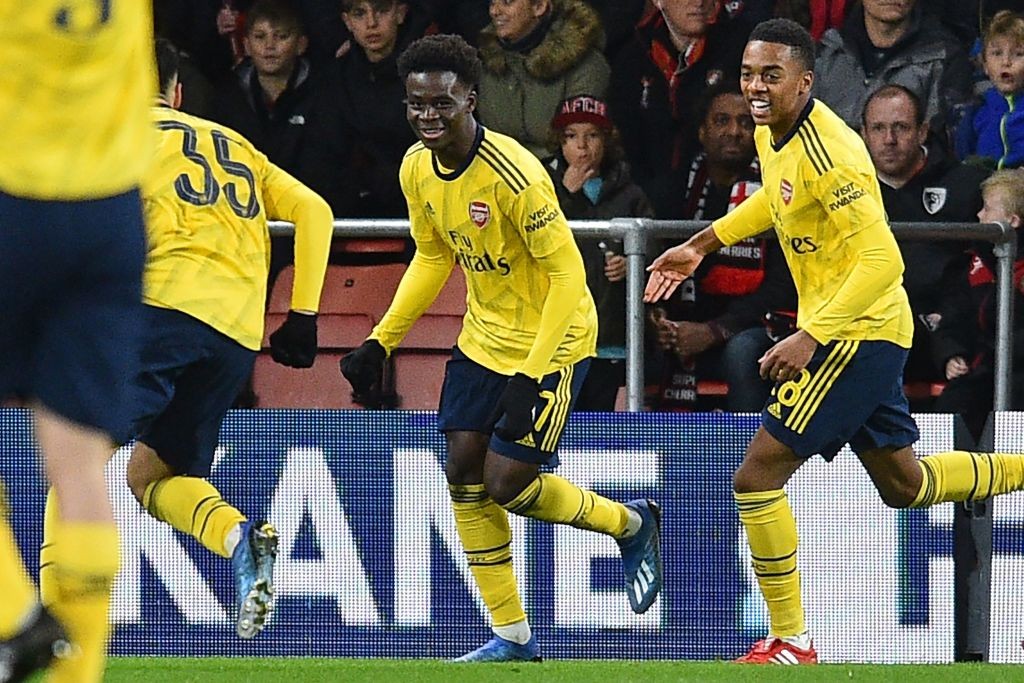 Arsenal's English striker Bukayo Saka (C) celebrates with teammates after scoring the opening goal of the English FA Cup fourth round football match between Bournemouth and Arsenal at the Vitality Stadium in Bournemouth, southern England on January 27, 2020. (Photo by Glyn KIRK / AFP)