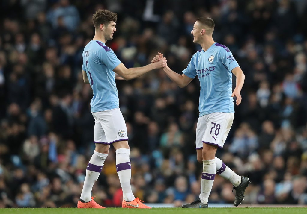 MANCHESTER, ENGLAND - JANUARY 04: Taylor Harwood-Bellis of Manchester City celebrates after scoring his team's third goal with teammate John Stones during the FA Cup Third Round match between Manchester City and Port Vale at Etihad Stadium on January 04, 2020, in Manchester, England. (Photo by Alex Livesey/Getty Images)