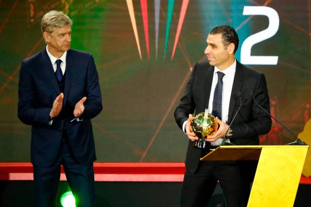 French coach Arsene Wenger (L) presents the Goal of the Year award to Kheiredine Zetchi, president of the Algerian Football Federation, during the 2019 CAF Awards in the Egyptian resort town of Hurghada on January 7, 2020. - Riyad Mahrez's free kick in the 2019 African Cup of Nations semi-finals was named as Goal of the Year during the 2019 CAF Awards. (Photo by Khaled DESOUKI / AFP) (Photo by KHALED DESOUKI/AFP via Getty Images)