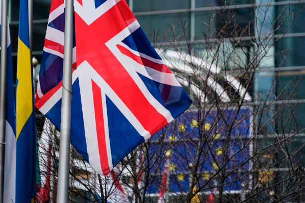 A picture taken on January 23, 2020 shows the European Union flag and the British Union Jack waving in front of the European Parliament in Brussels. (Photo by Kenzo TRIBOUILLARD / AFP) (Photo by KENZO TRIBOUILLARD/AFP via Getty Images)