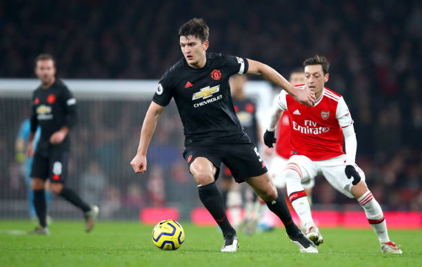 LONDON, ENGLAND - JANUARY 01: Harry Maguire of Manchester United runs with the ball during the Premier League match between Arsenal FC and Manchester United at Emirates Stadium on January 01, 2020 in London, United Kingdom. (Photo by Julian Finney/Getty Images)